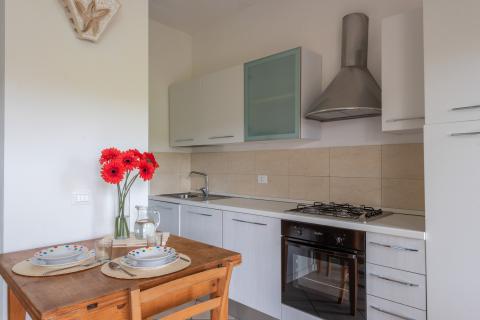 Residence Baja Sardinia, Tritt Case in Italia